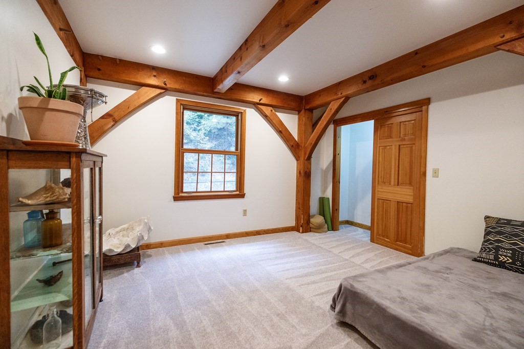 77 Swamp Road Montague, MA 01351 - Photo 17 of 35 a bedroom with a bed and wooden floor