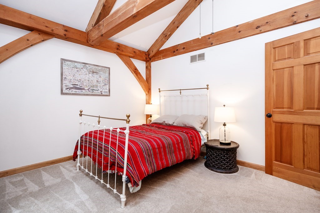 77 Swamp Road Montague, MA 01351 - Photo 18 of 35 a bed sitting in a room next to a window