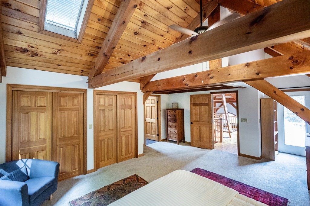 77 Swamp Road Montague, MA 01351 - Photo 22 of 35 a living room with furniture and a rug