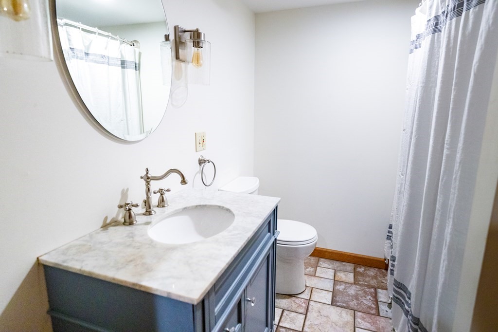 77 Swamp Road Montague, MA 01351 - Photo 28 of 35 a bathroom with a sink and a mirror