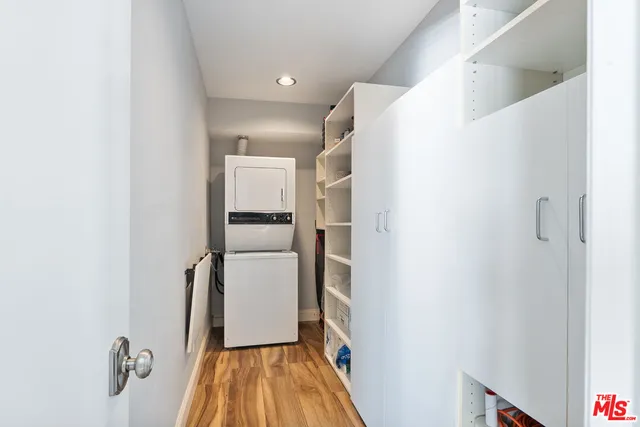 a view of hallway with wooden floor