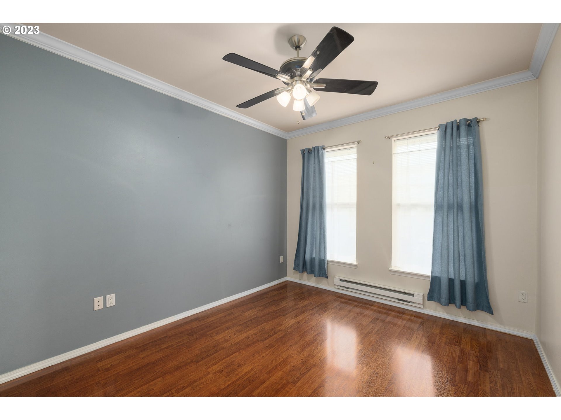 1110 Northeast 63rd Way, Unit 2009 Hillsboro, OR 97124 - Photo 12 of 31 an empty room with wooden floor and windows