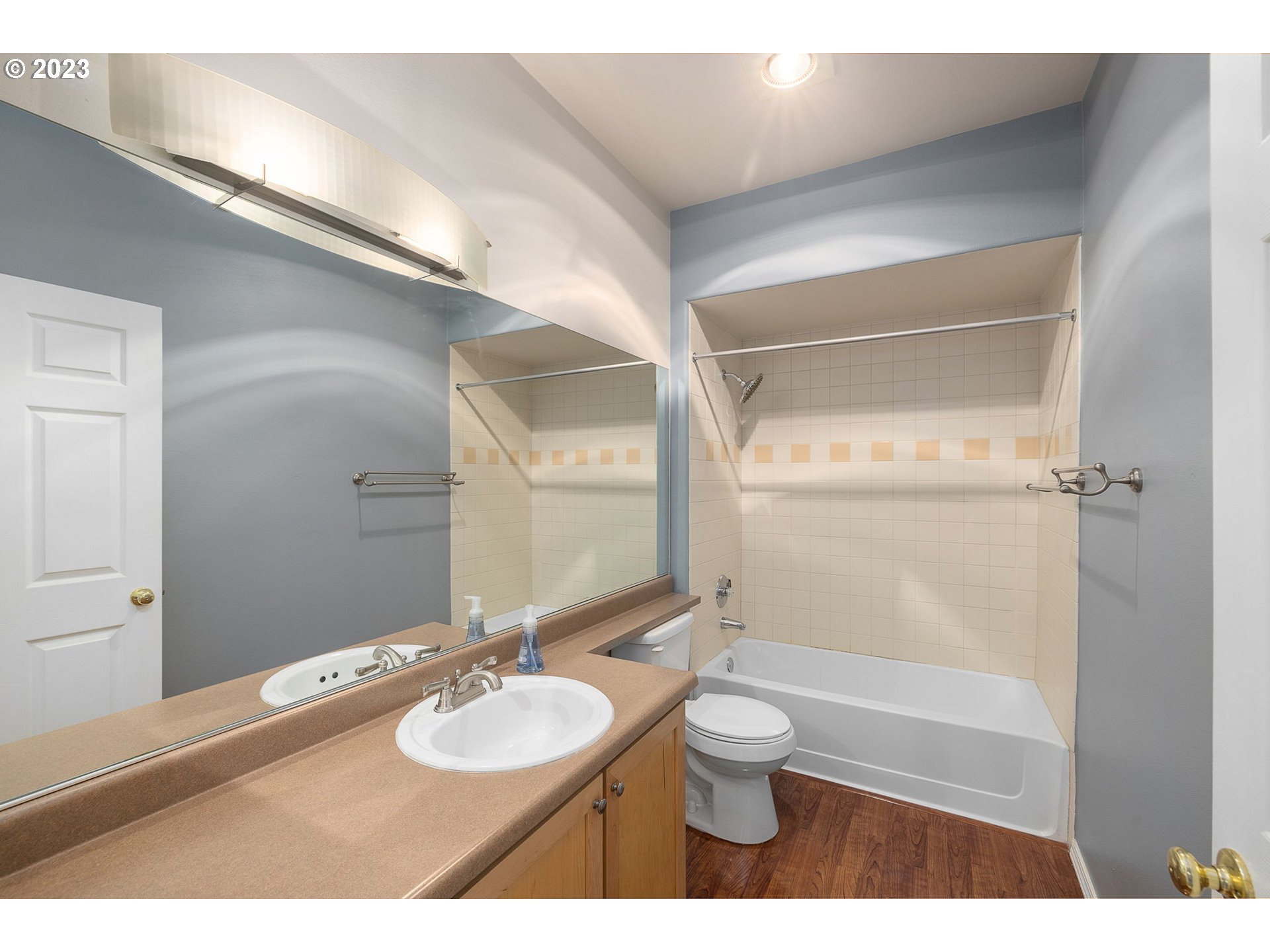 1110 Northeast 63rd Way, Unit 2009 Hillsboro, OR 97124 - Photo 14 of 31 a bathroom with a granite countertop sink toilet a large mirror and shower