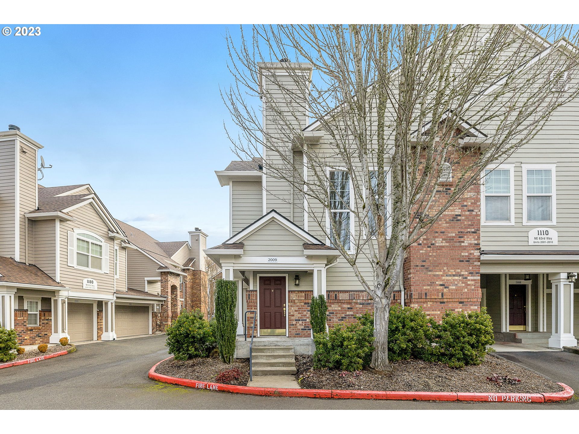 1110 Northeast 63rd Way, Unit 2009 Hillsboro, OR 97124 - Photo 2 of 31 a front view of a residential houses with yard