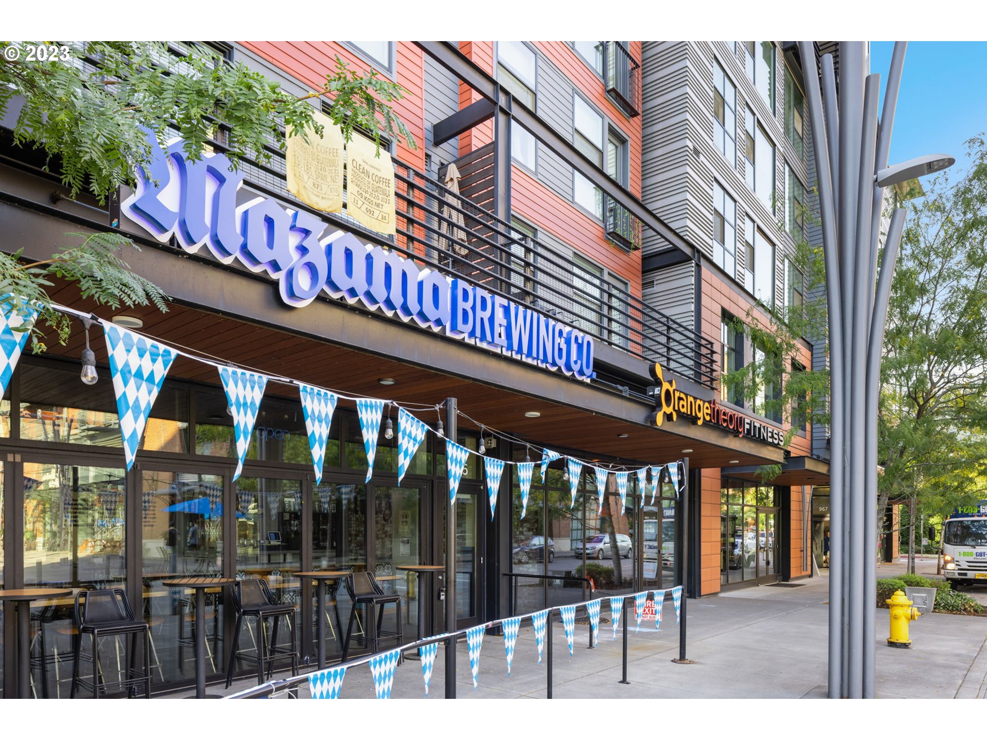 1110 Northeast 63rd Way, Unit 2009 Hillsboro, OR 97124 - Photo 27 of 31 a view of a building with a glass door