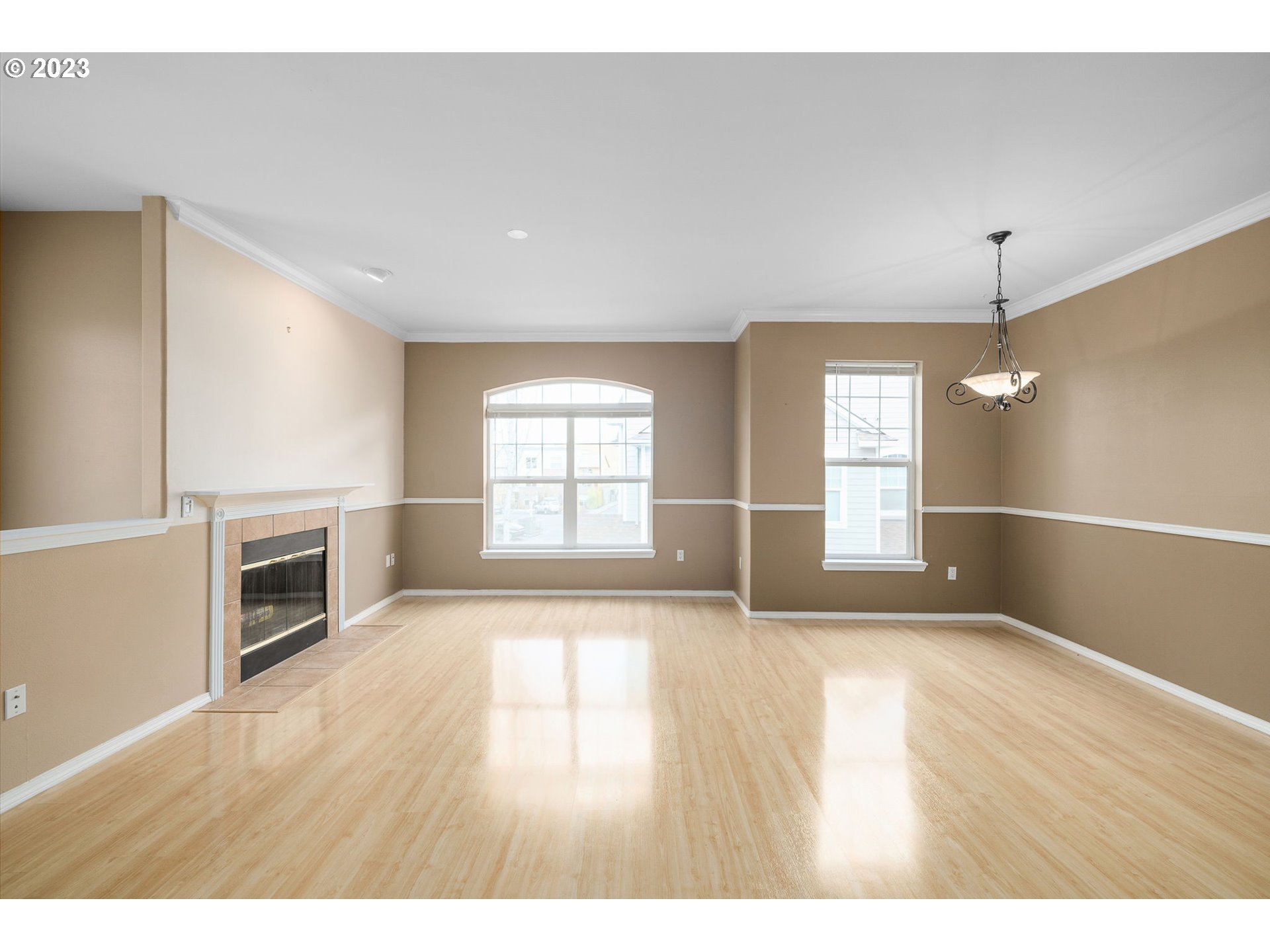 1110 Northeast 63rd Way, Unit 2009 Hillsboro, OR 97124 - Photo 5 of 31 a view of an empty room with a window and wooden floor