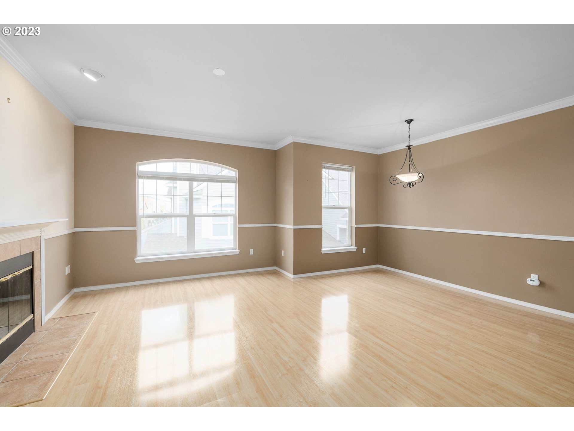 1110 Northeast 63rd Way, Unit 2009 Hillsboro, OR 97124 - Photo 6 of 31 a view of an empty room with wooden floor and a window