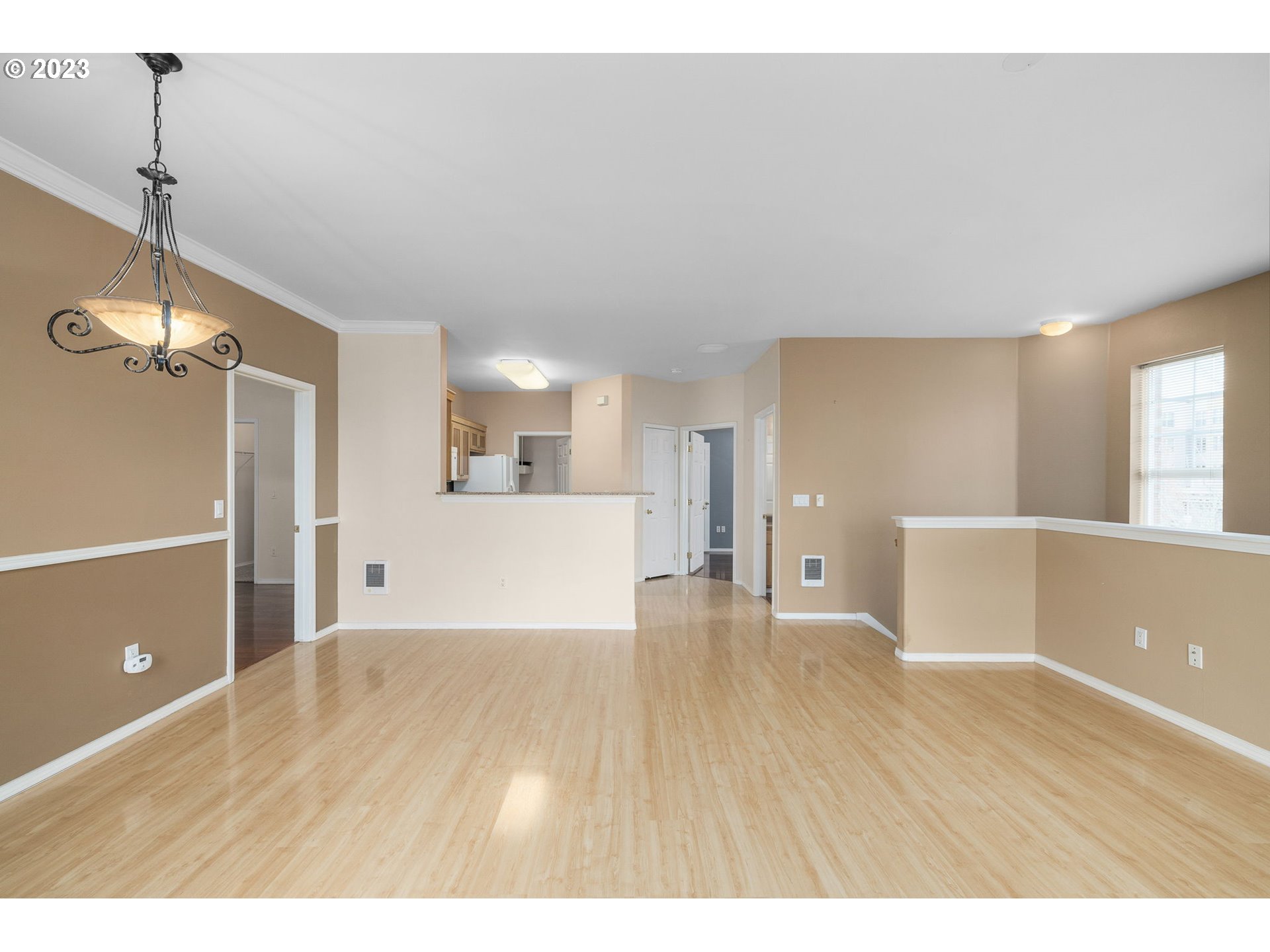 1110 Northeast 63rd Way, Unit 2009 Hillsboro, OR 97124 - Photo 7 of 31 a view of a room with wooden floor and a cabinet