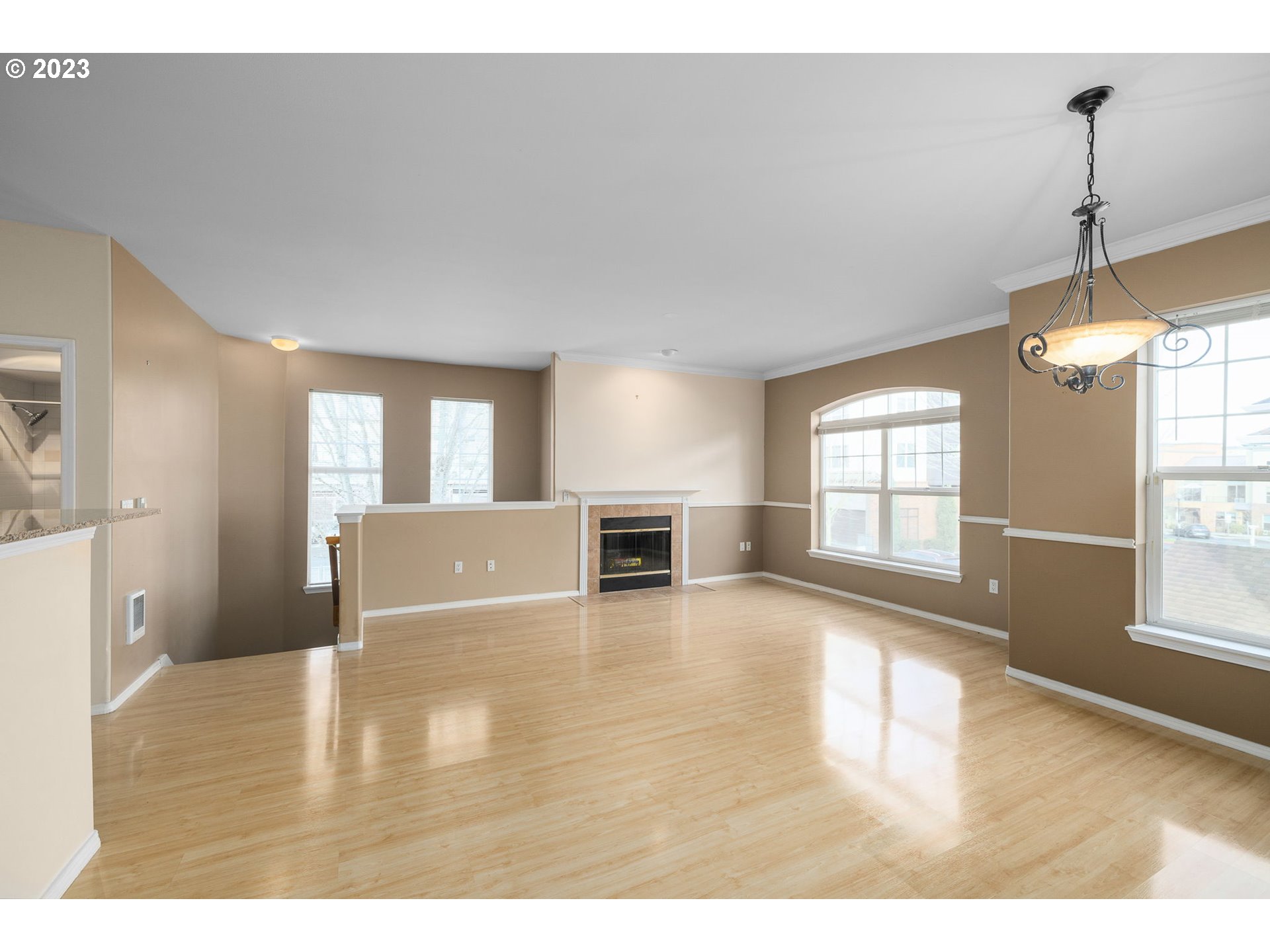 1110 Northeast 63rd Way, Unit 2009 Hillsboro, OR 97124 - Photo 9 of 31 a view of a livingroom with wooden floor and windows