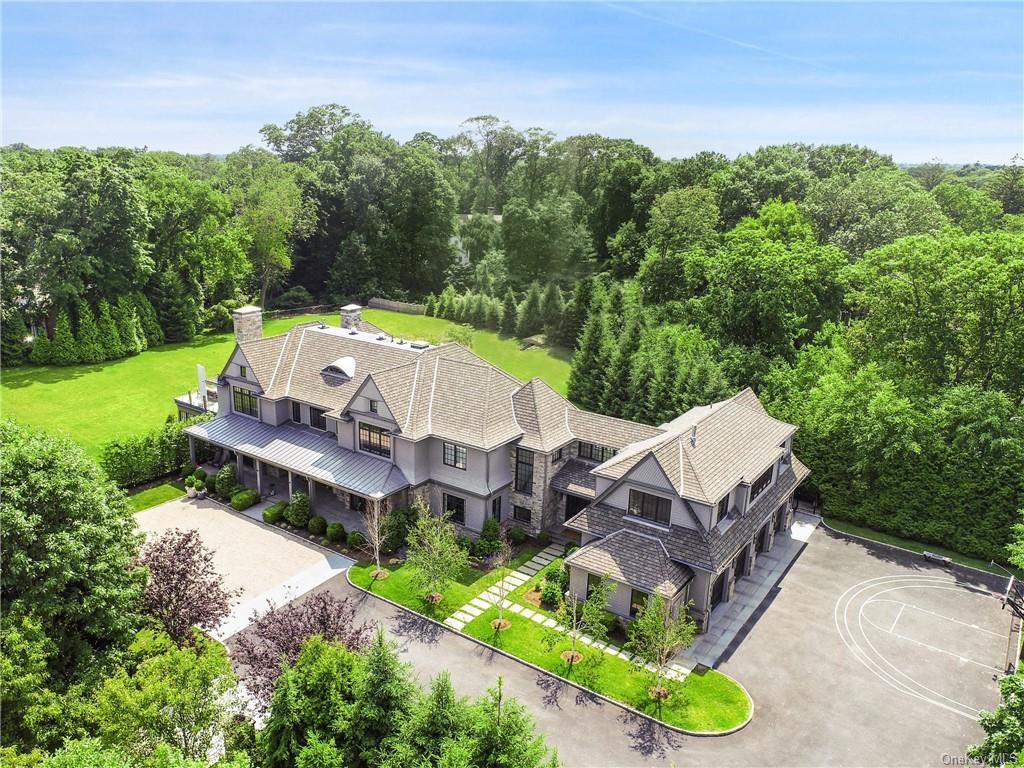 an aerial view of a house with garden space and street view