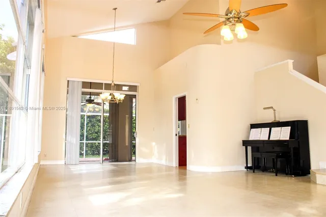 a kitchen with granite countertop wood cabinets and a stove top oven