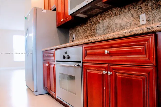 a view of a sink and a window