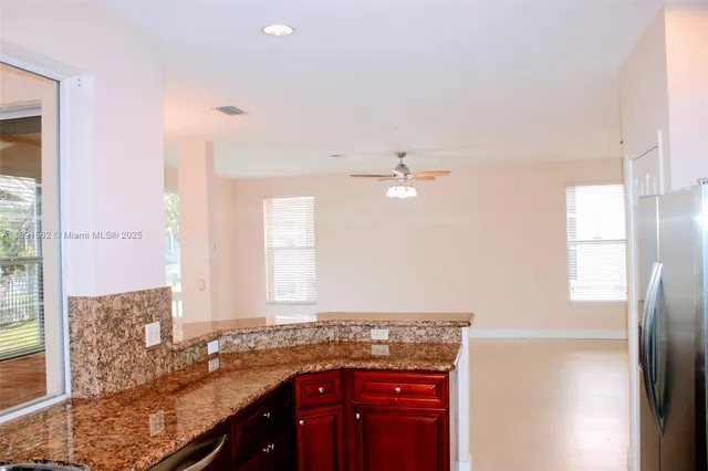 a bathroom with a toilet a sink and a window