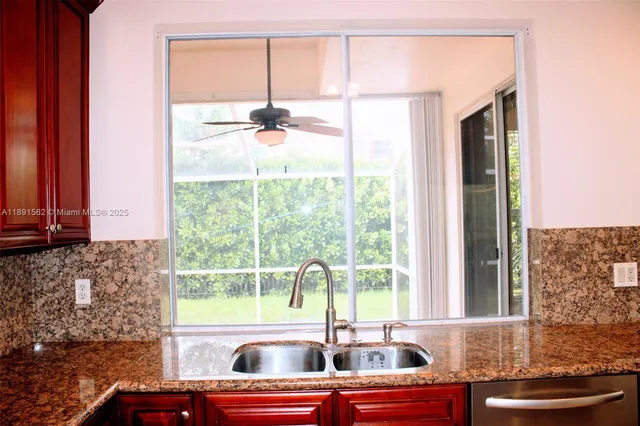 a view of room with window and entryway