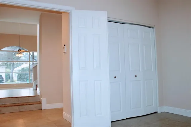 a bathroom with a sink vanity granite tub and a mirror