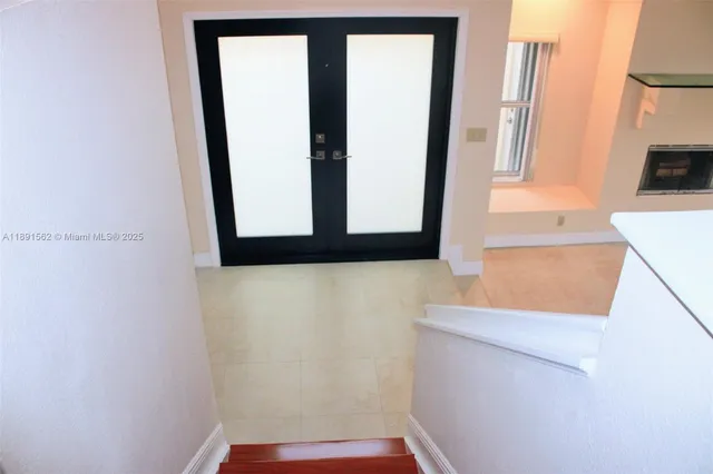 a bathroom with a tub and shower