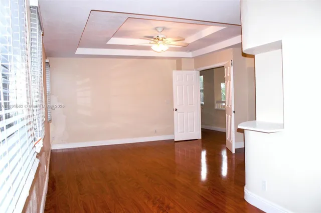 a view of an empty room with a window