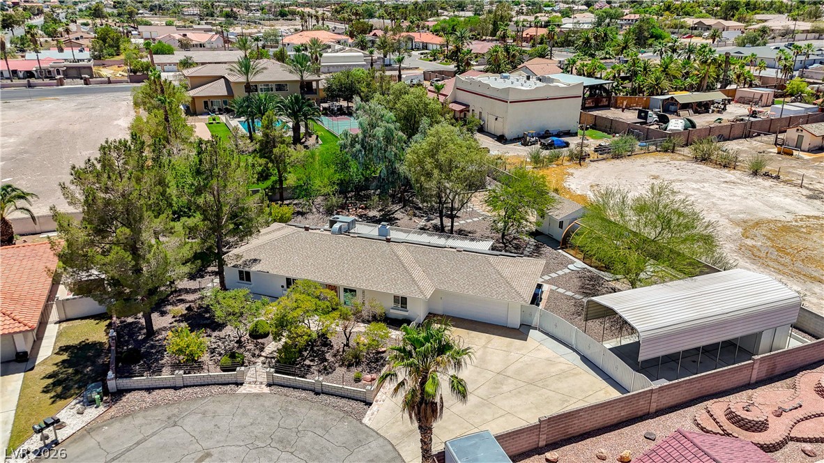 7631 Bermuda Road Las Vegas, NV 89123 - Photo 51 of 64 An aerial perspective reveals the property's vast grounds and lush tree-lined setting, complete with a private tennis court.