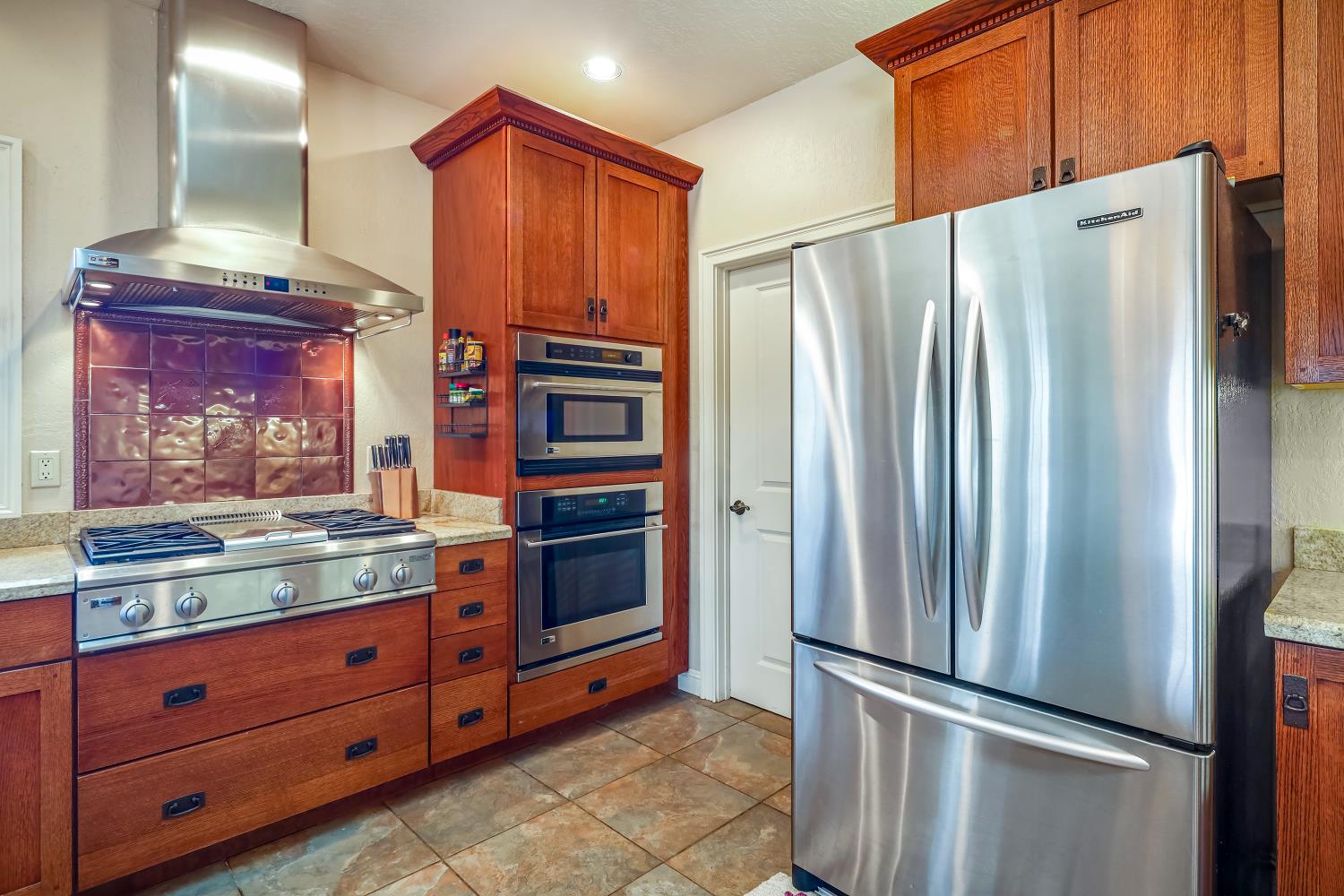 5603 Gold Mountain Road Mountain Ranch, CA 95246 - Photo 19 of 78 a kitchen with stainless steel appliances granite countertop a refrigerator and a stove