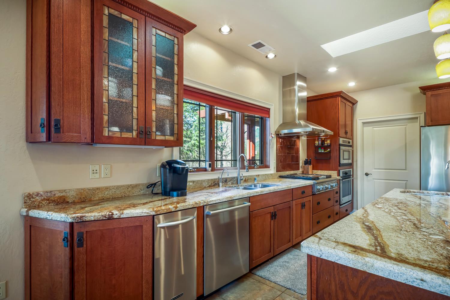 5603 Gold Mountain Road Mountain Ranch, CA 95246 - Photo 20 of 78 a kitchen with a sink stove and cabinets