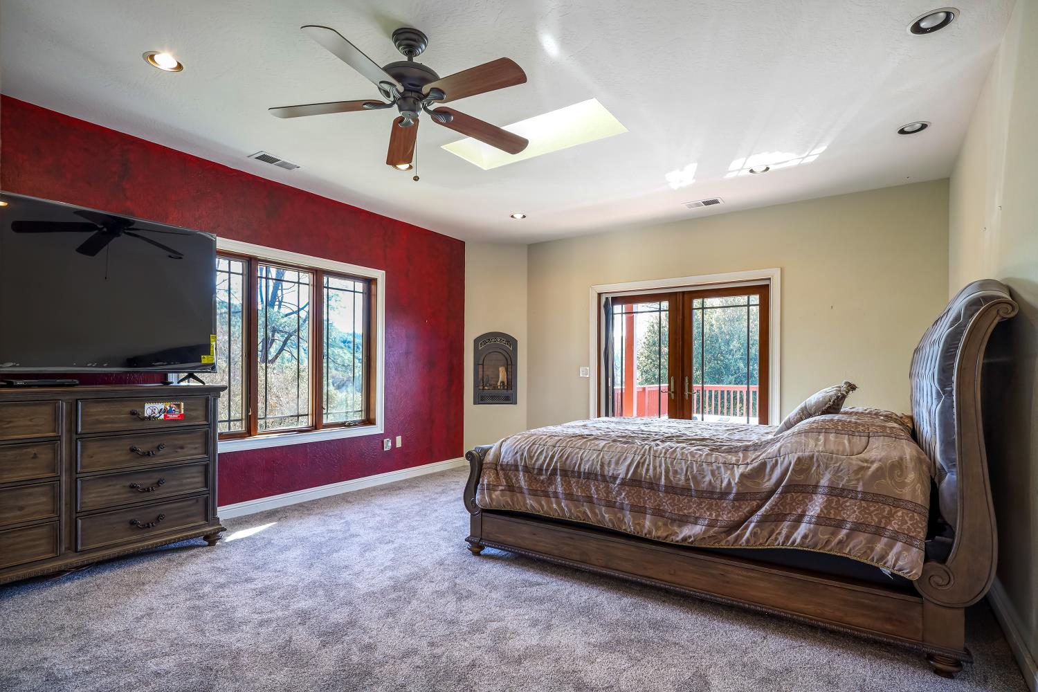 5603 Gold Mountain Road Mountain Ranch, CA 95246 - Photo 24 of 78 a bedroom with a bed and a flat screen tv