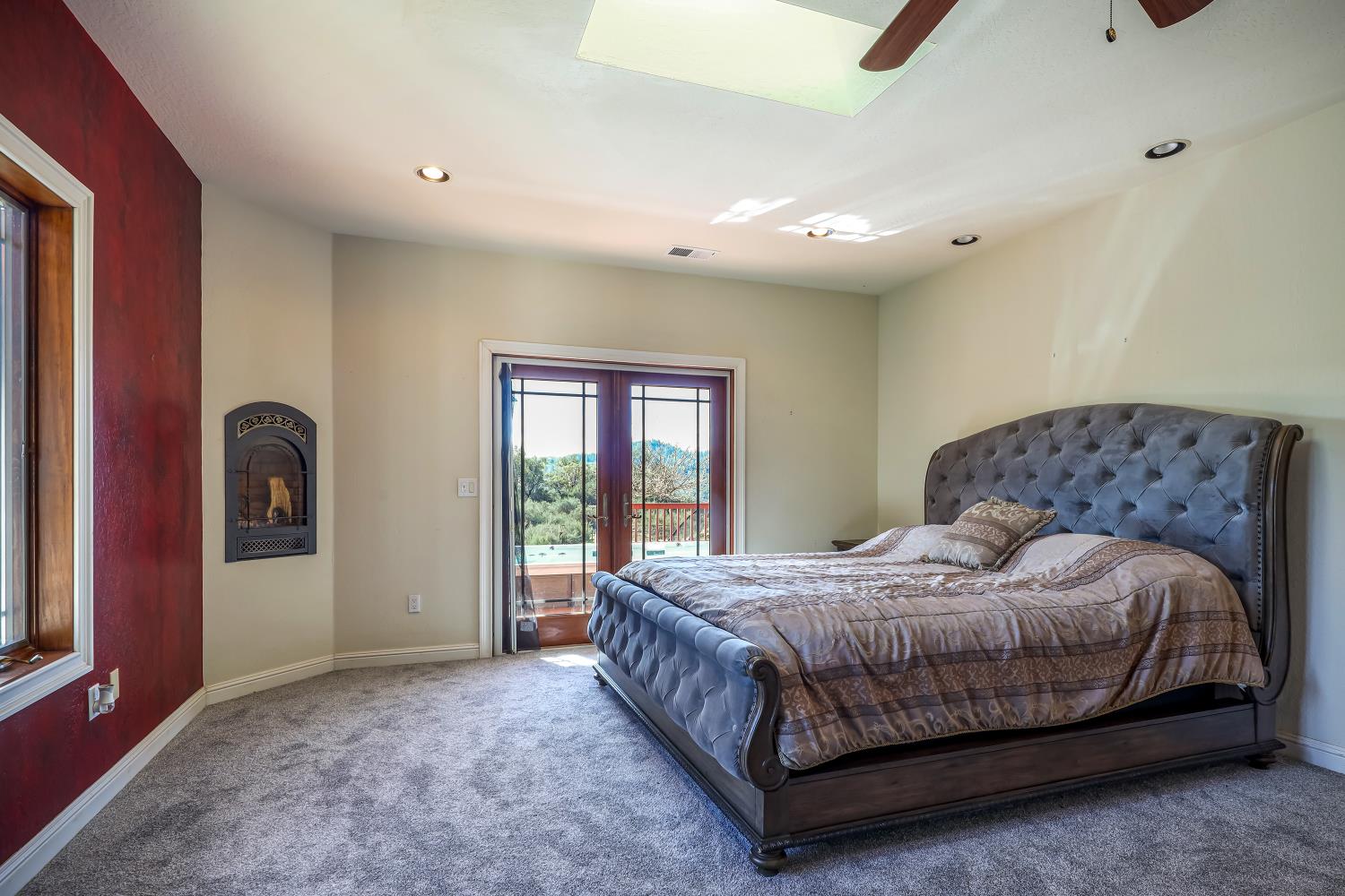 5603 Gold Mountain Road Mountain Ranch, CA 95246 - Photo 25 of 78 a bedroom with a bed and window
