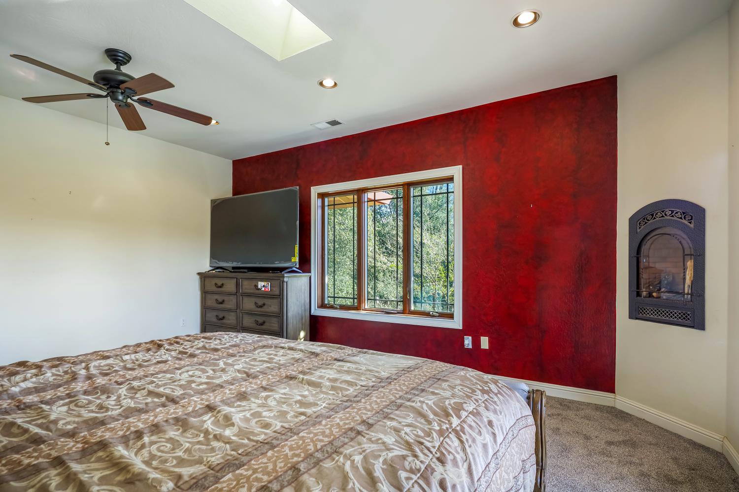 5603 Gold Mountain Road Mountain Ranch, CA 95246 - Photo 26 of 78 a bedroom with a bed and a flat screen tv
