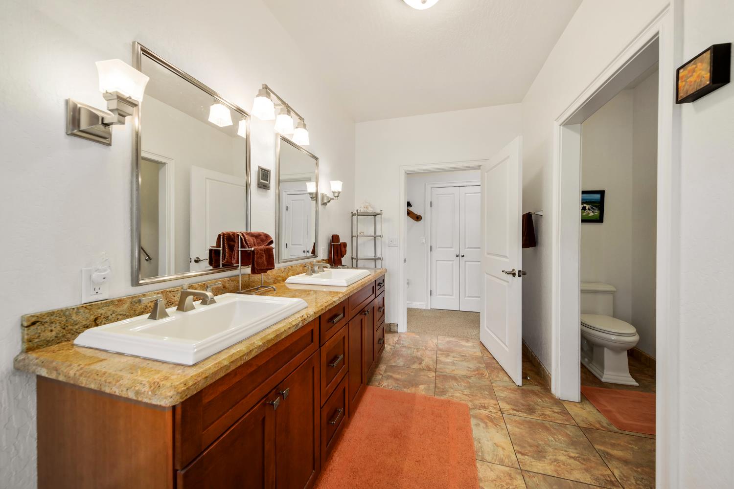 5603 Gold Mountain Road Mountain Ranch, CA 95246 - Photo 28 of 78 a spacious bathroom with a sink and a mirror