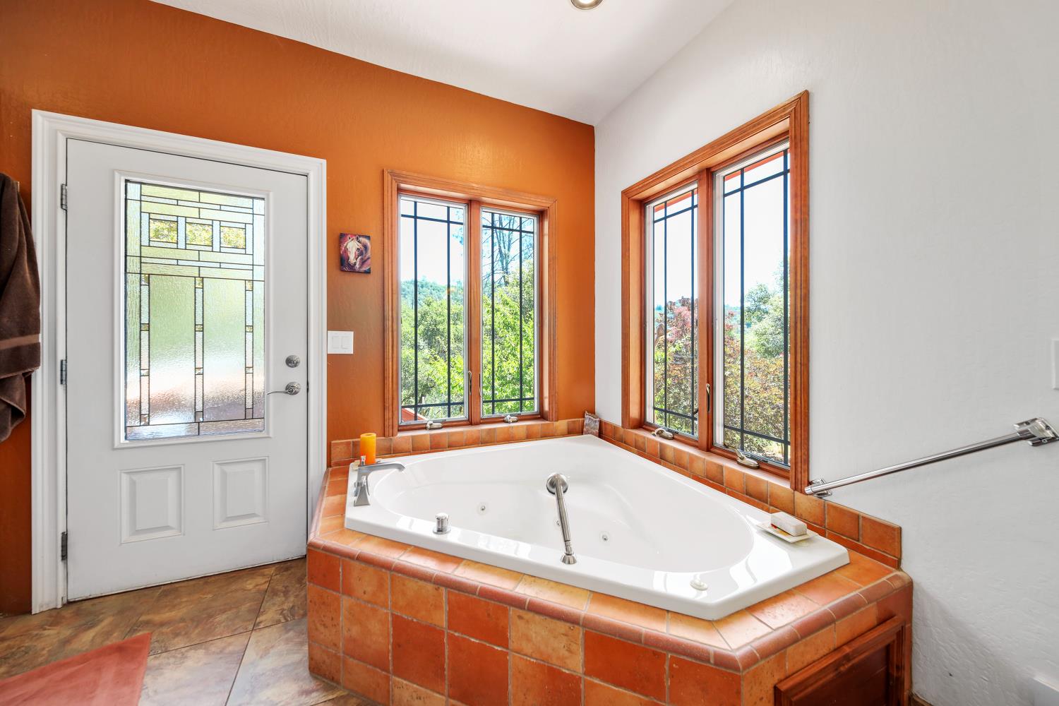 5603 Gold Mountain Road Mountain Ranch, CA 95246 - Photo 29 of 78 a bath tub sitting in a bathroom next to a window
