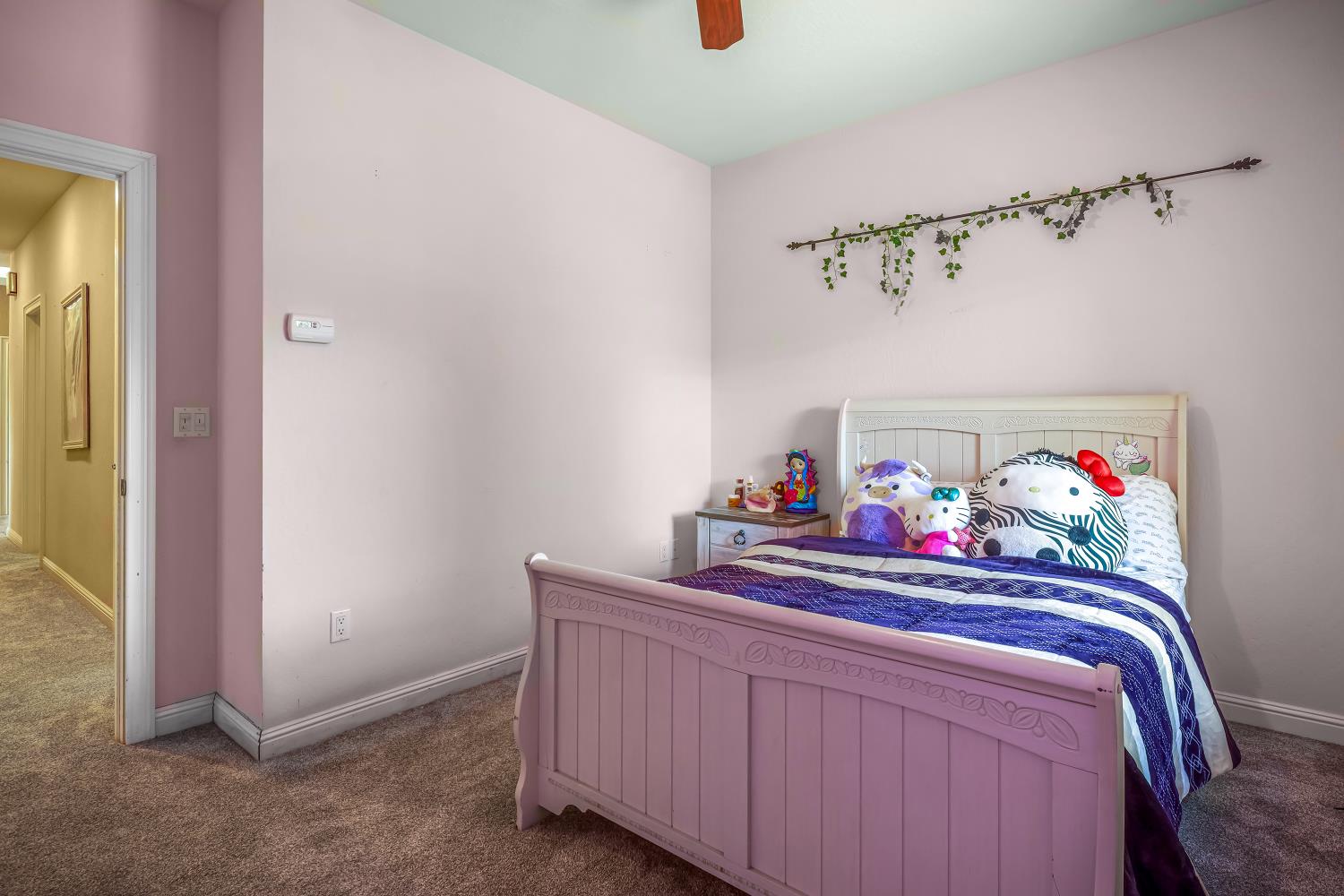 5603 Gold Mountain Road Mountain Ranch, CA 95246 - Photo 34 of 78 a bedroom with a bed and wooden floor