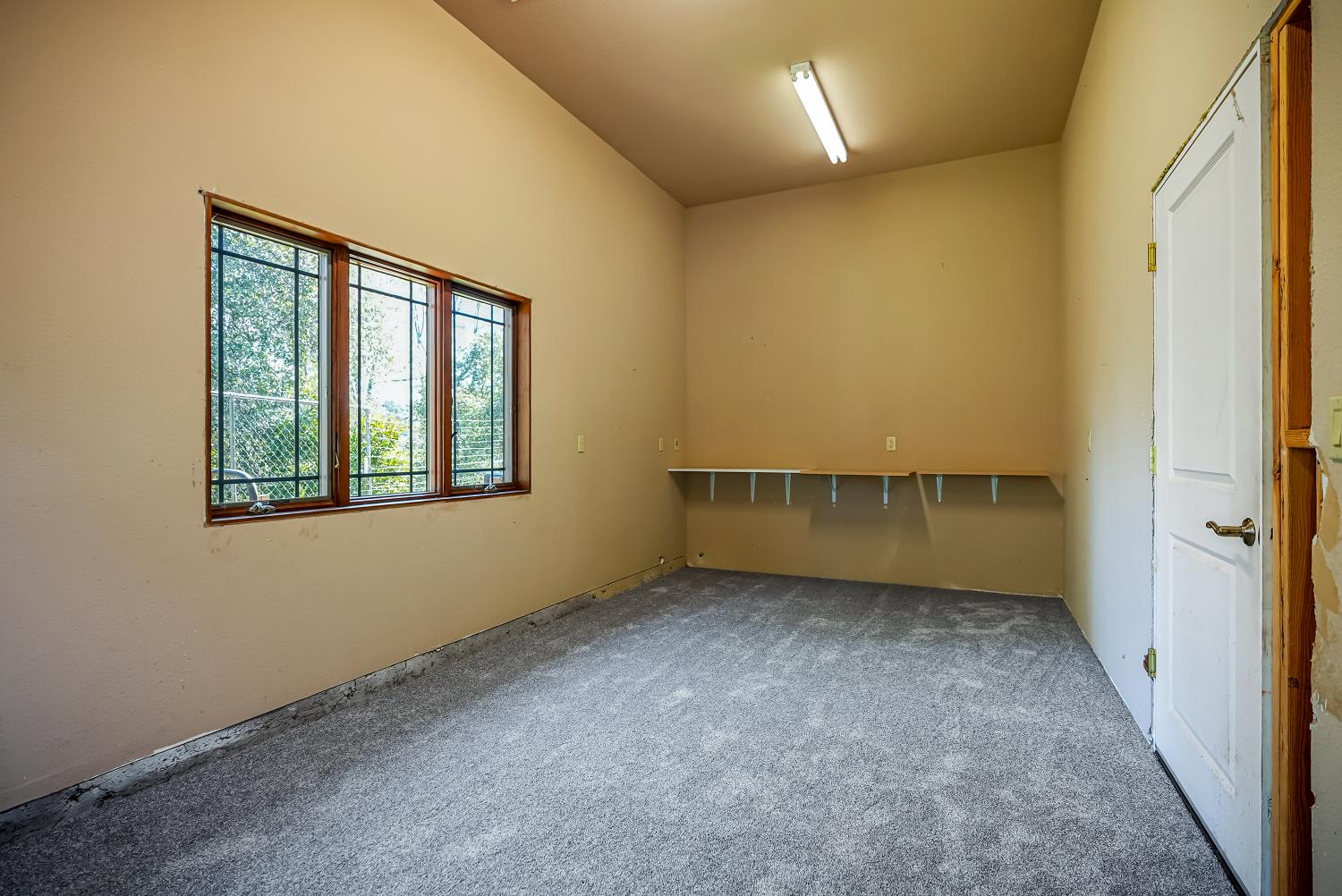 5603 Gold Mountain Road Mountain Ranch, CA 95246 - Photo 37 of 78 an empty room with a window
