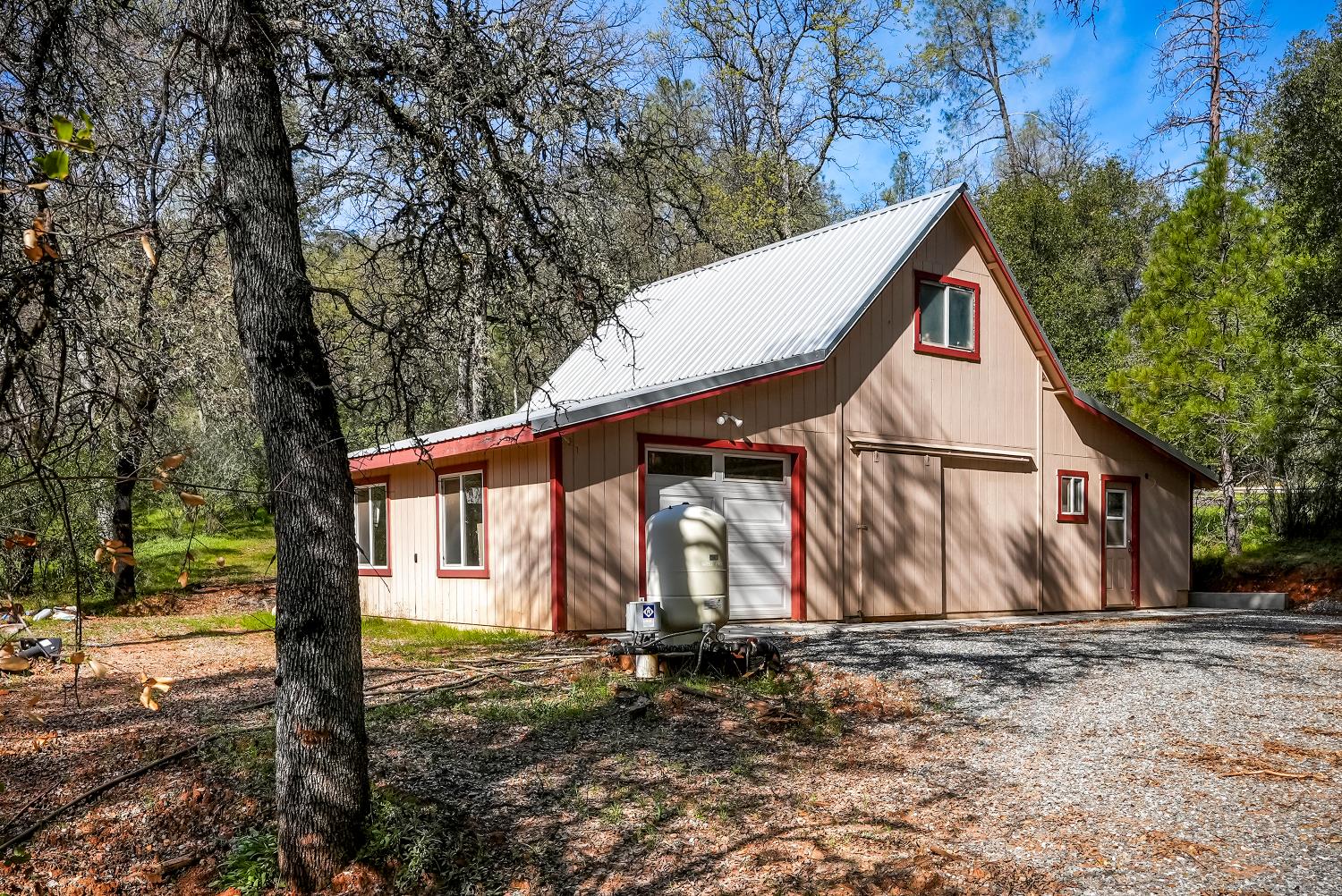 5603 Gold Mountain Road Mountain Ranch, CA 95246 - Photo 62 of 78 a view of a house with a yard
