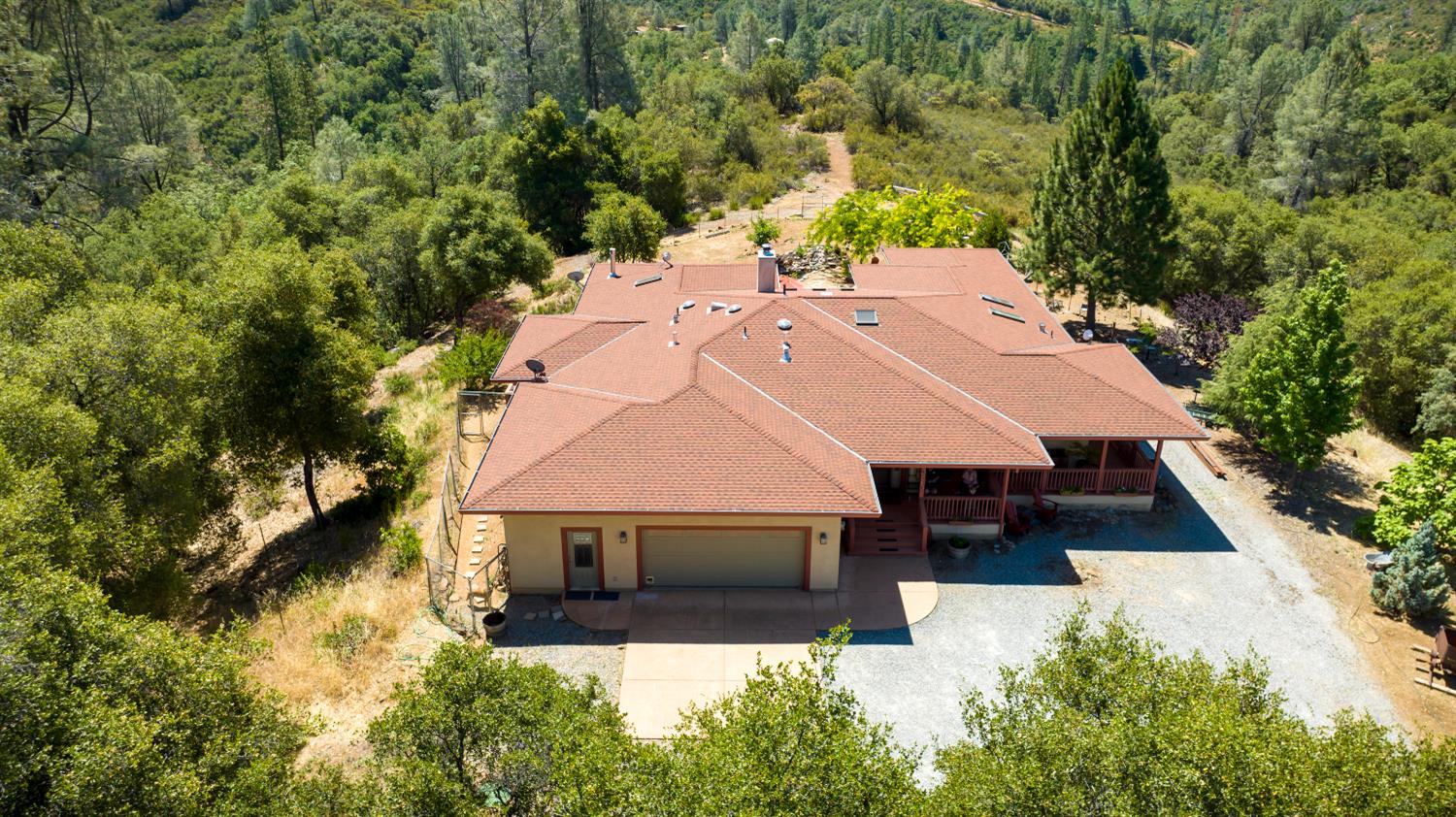 5603 Gold Mountain Road Mountain Ranch, CA 95246 - Photo 65 of 78 an aerial view of a house with yard and garage