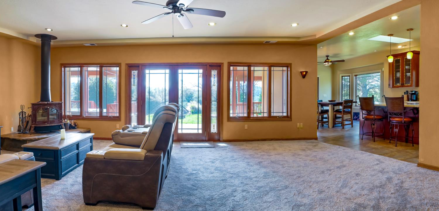 5603 Gold Mountain Road Mountain Ranch, CA 95246 - Photo 7 of 78 a living room with furniture and a floor to ceiling window