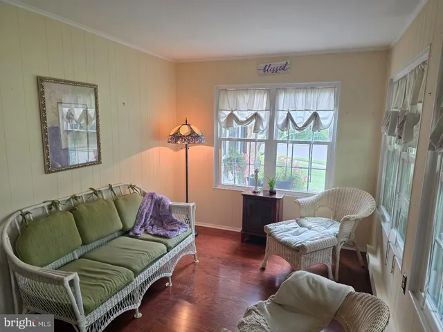a living room with furniture a lamp and a fireplace