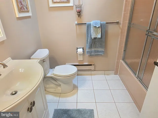 a bedroom with bed and window