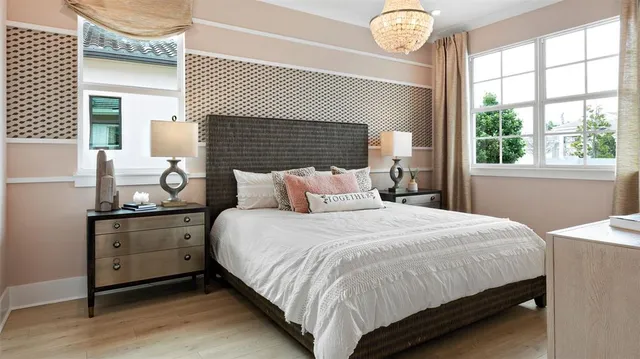 a bedroom with bed and window