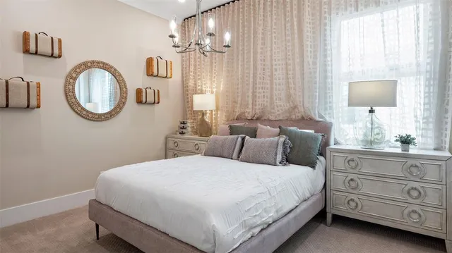 a bedroom with bed and a window