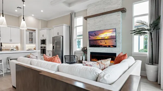 a living room with furniture fireplace and flat screen tv