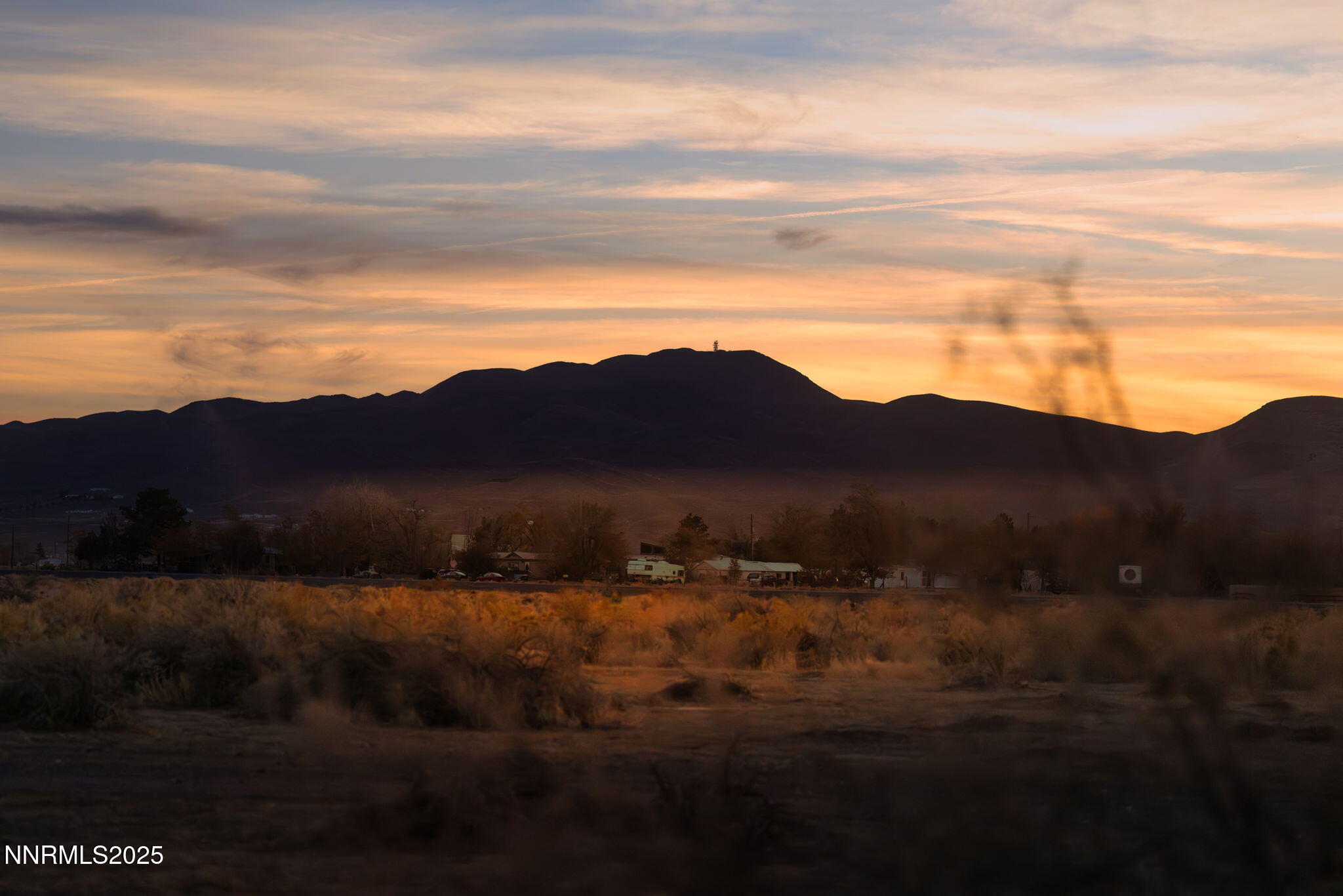 3770 Ft Churchill Street Silver Springs, NV 89429 - Photo 23 of 24 a view of mountain with sunset in background