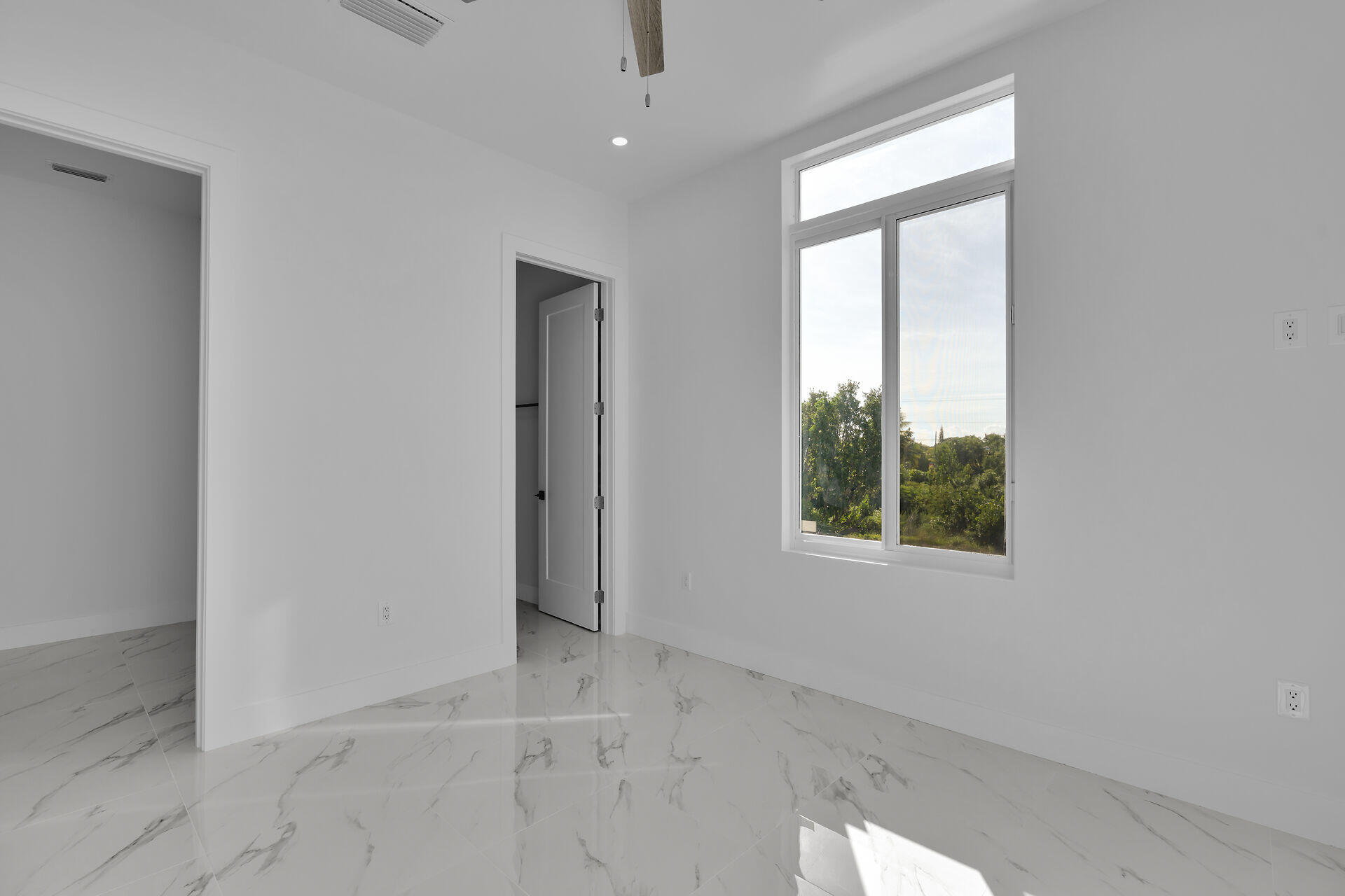 31368 Ave I Big Pine Key, FL 33043 - Photo 18 of 47 an empty room with windows and closet