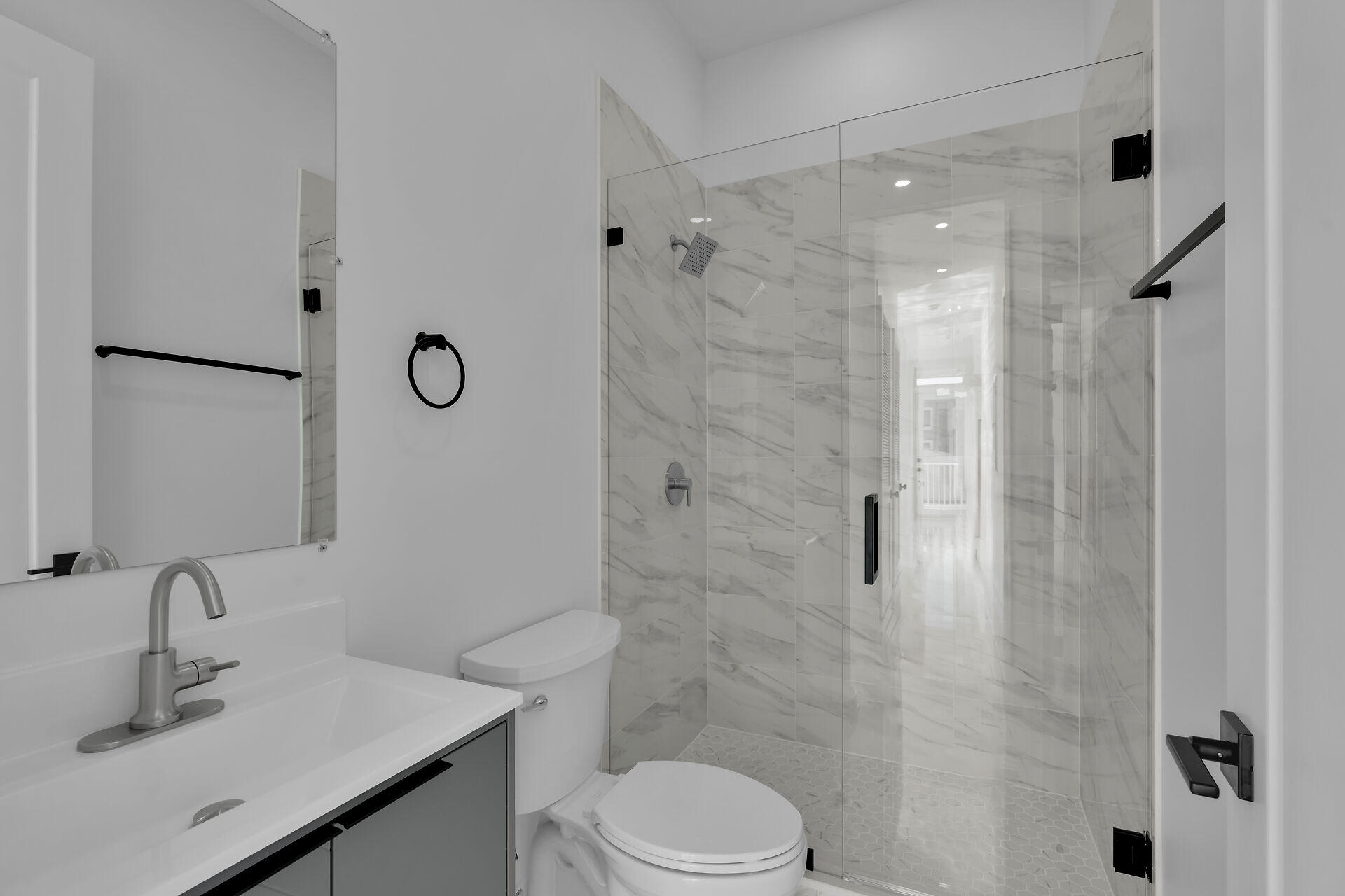 31368 Ave I Big Pine Key, FL 33043 - Photo 24 of 47 a bathroom with a sink toilet and shower