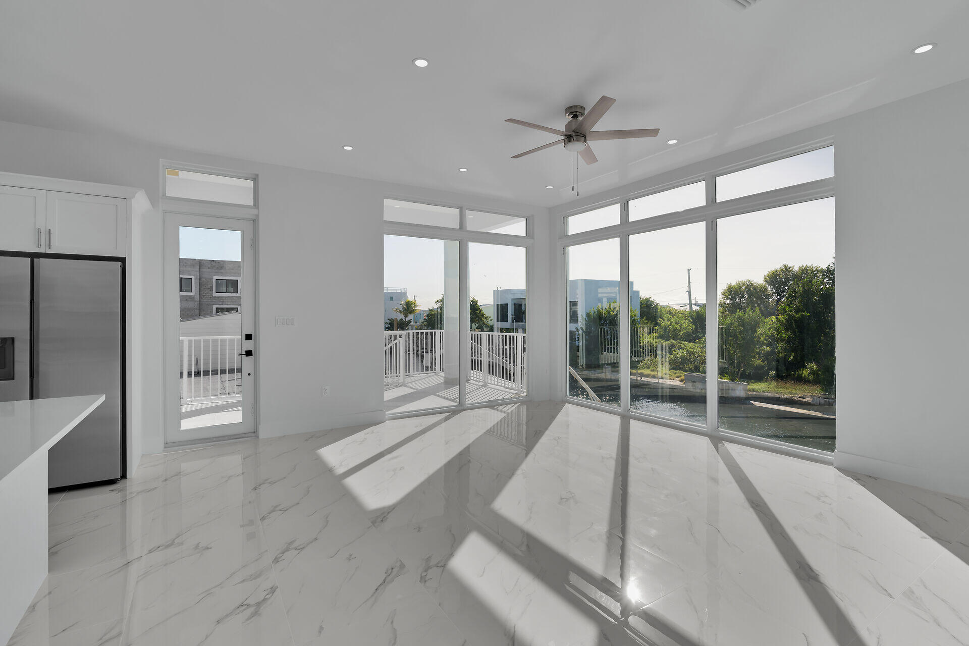 31368 Ave I Big Pine Key, FL 33043 - Photo 5 of 47 a spacious bedroom with a large bed and a large window