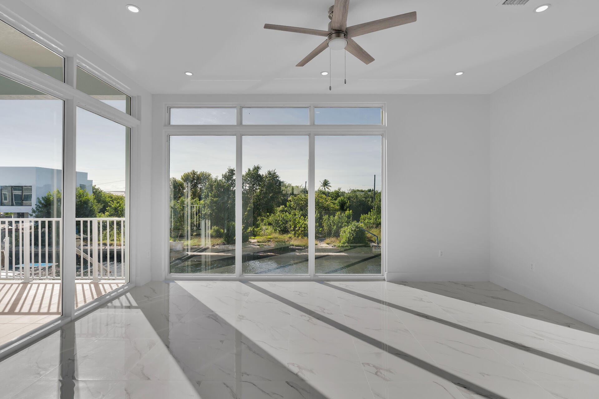 31368 Ave I Big Pine Key, FL 33043 - Photo 7 of 47 a view of room with a large window and kitchen view