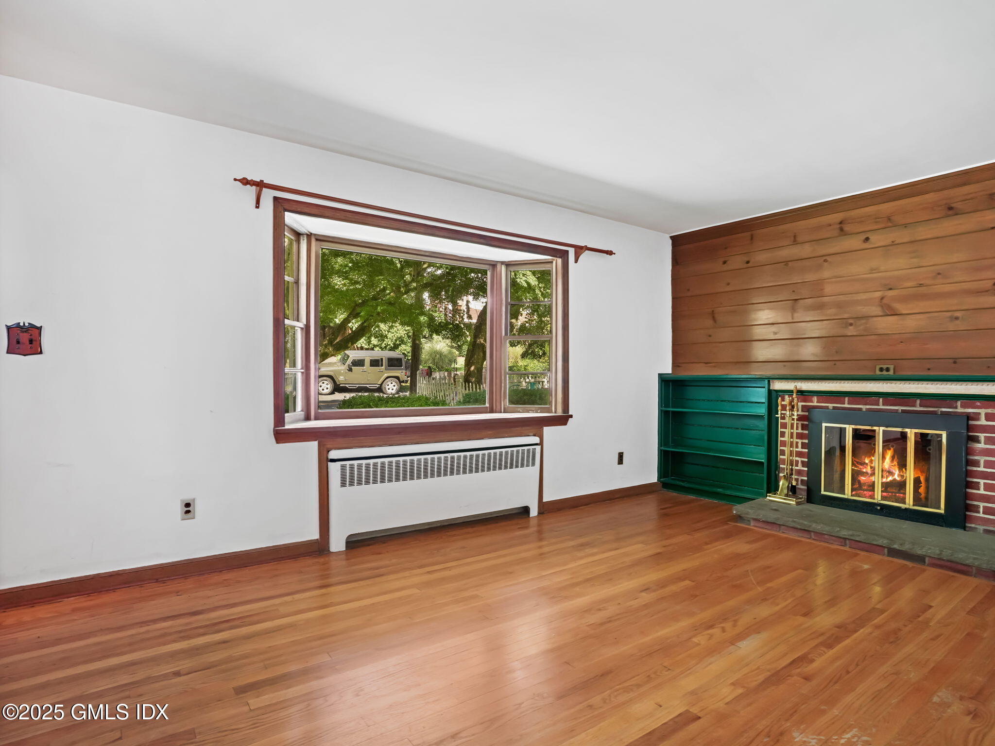 11 Perna Lane Riverside, CT 06878 - Photo 2 of 12 a view of an empty room with a window and wooden floor