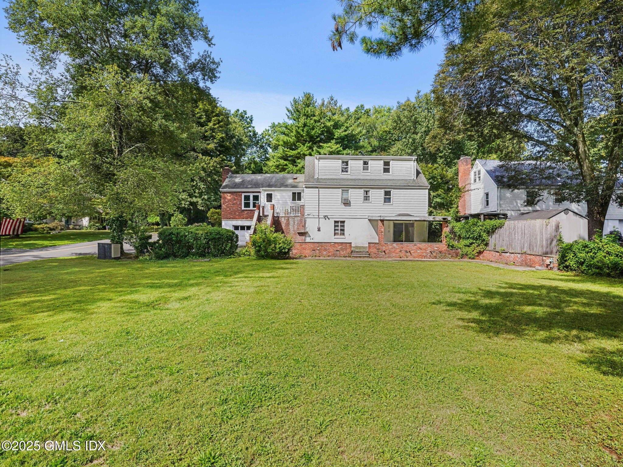 11 Perna Lane Riverside, CT 06878 - Photo 9 of 12 a view of a house with a big yard