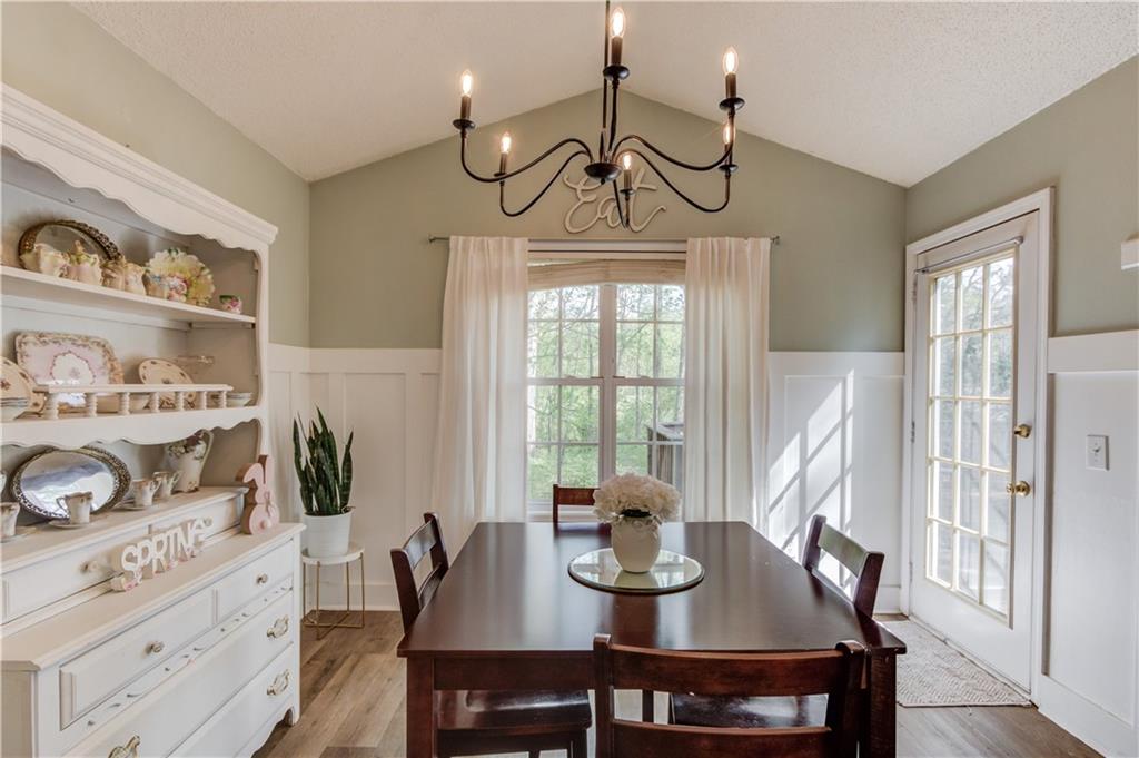 925 Nature Trail Bethlehem, GA 30620 - Photo 13 of 41 a view of a dining room with furniture window and wooden floor