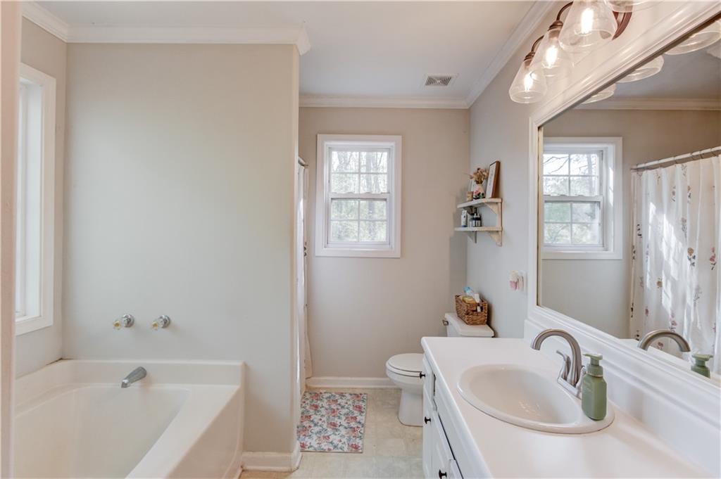 925 Nature Trail Bethlehem, GA 30620 - Photo 22 of 41 a bathroom with a sink and a bathtub
