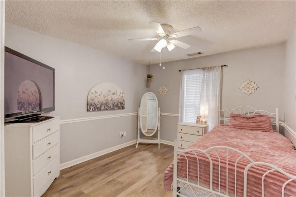 925 Nature Trail Bethlehem, GA 30620 - Photo 24 of 41 a bedroom with a bed and a flat screen tv
