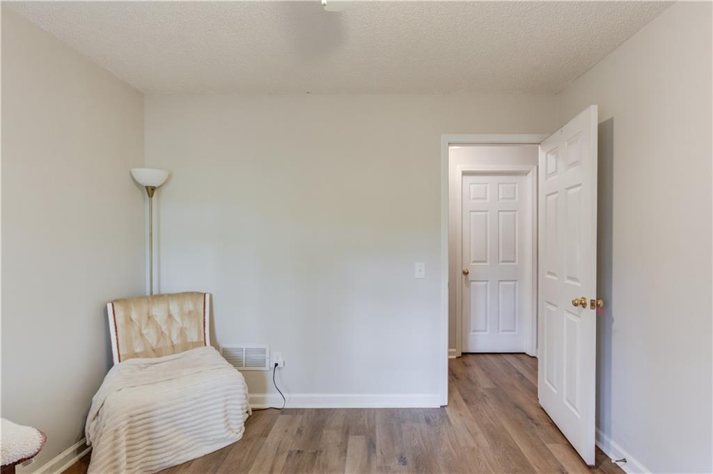 925 Nature Trail Bethlehem, GA 30620 - Photo 28 of 41 a room with a bed and a wooden floor